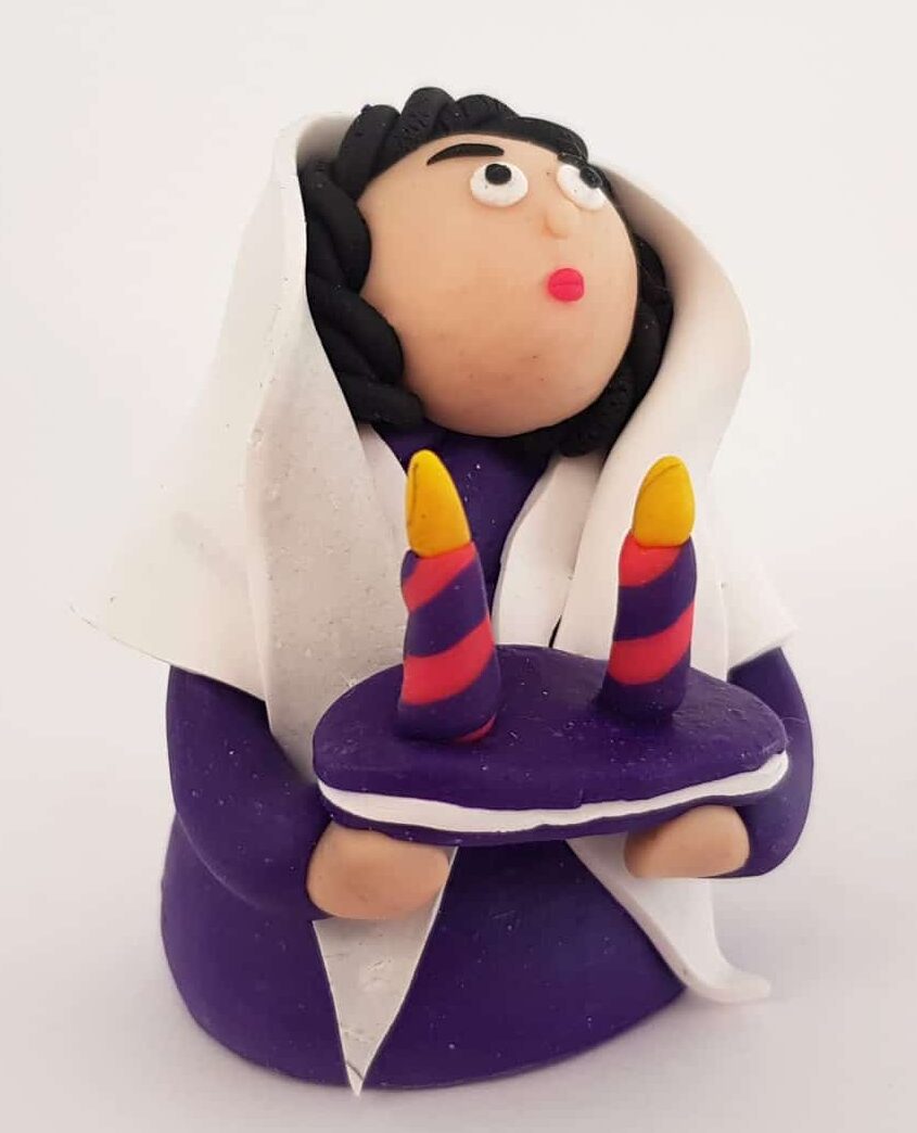 Jewish lady art doll with pair of Shabbat candlesticks